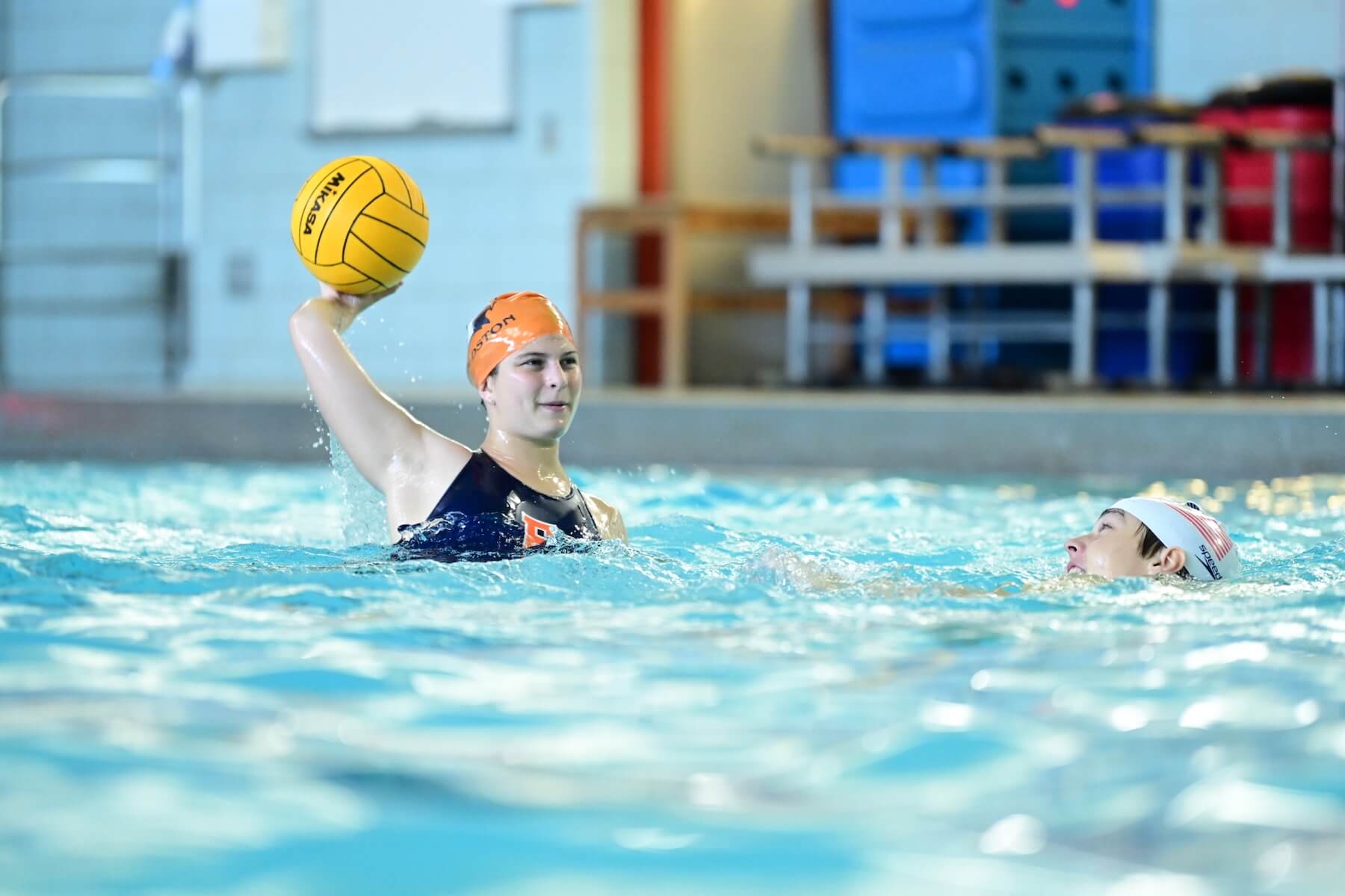 Ethical Culture Fieldston School Fieldston Upper water polo player in pool throws the ball