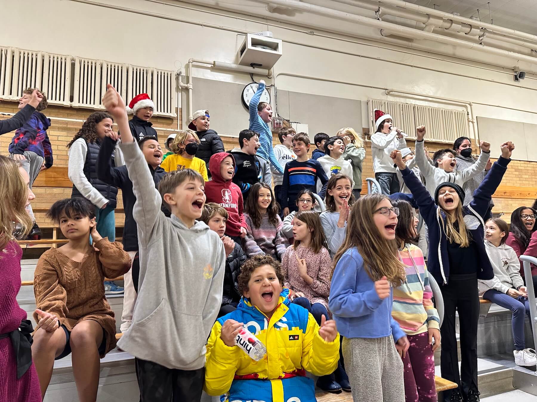 Ethical Culture Fieldston School Fieldston Lower students in the bleachers cheering on friends