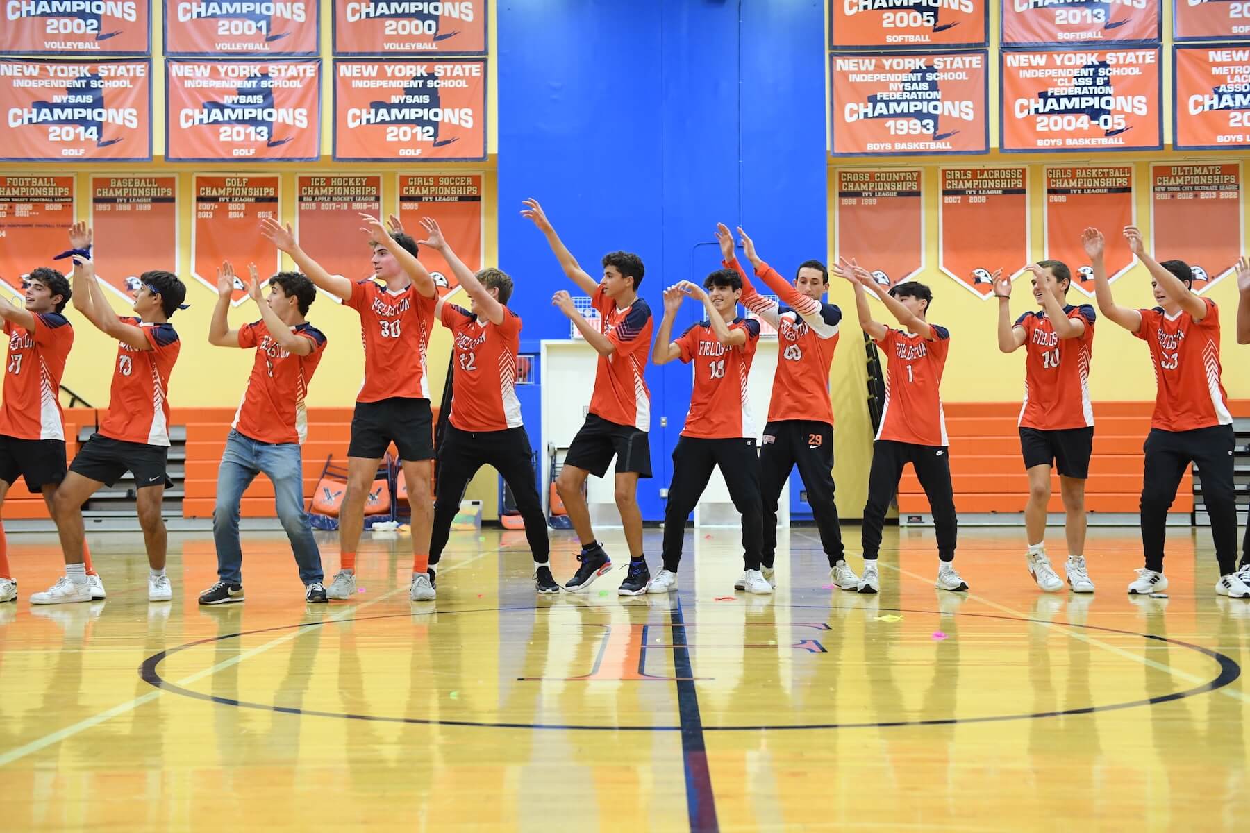 Ethical Culture Fieldston School Fieldston Upper students performing in a line during pep rally