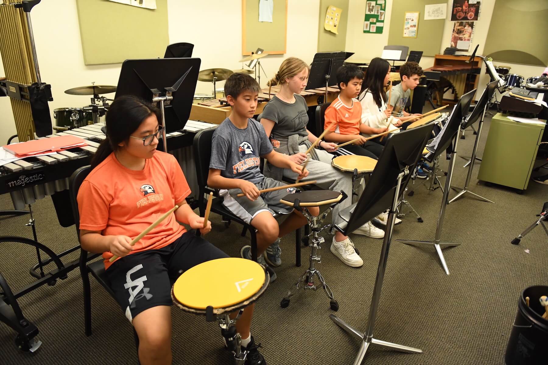 Ethical Culture Fieldston School group of Fieldston Middle percussion ensemble rehearsing