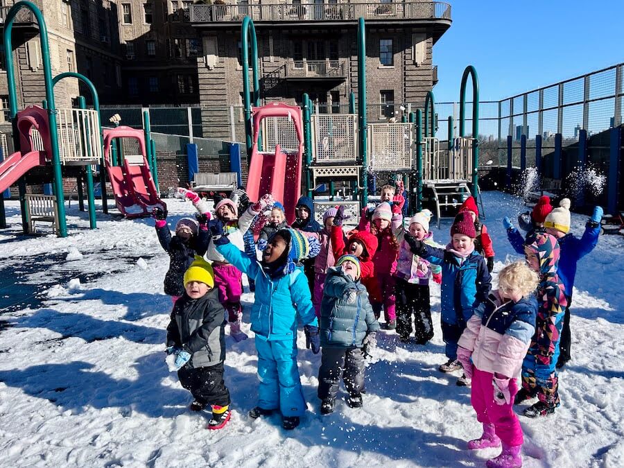 Ethical Culture Fieldston School students play in the snow in our rooftop playground