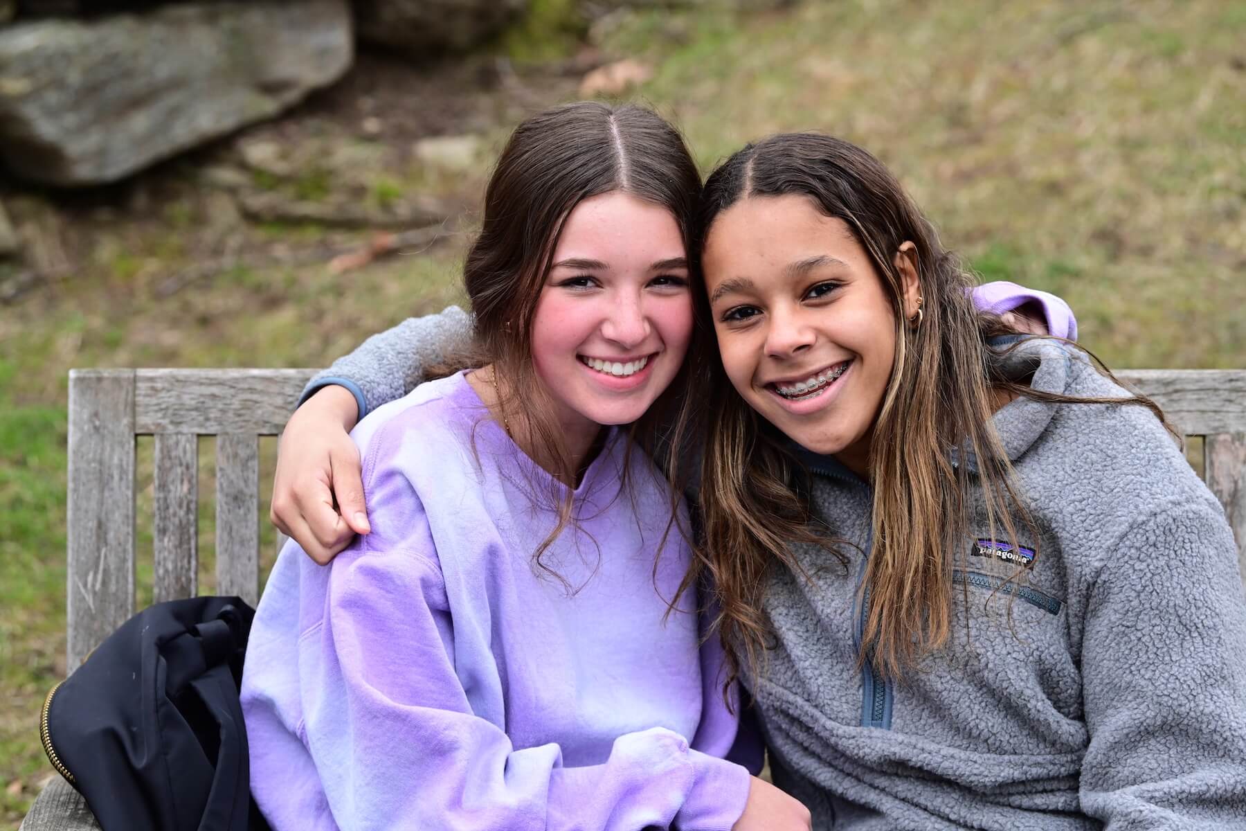 Two Ethical Culture Fieldston School Upper School students smile at the camera