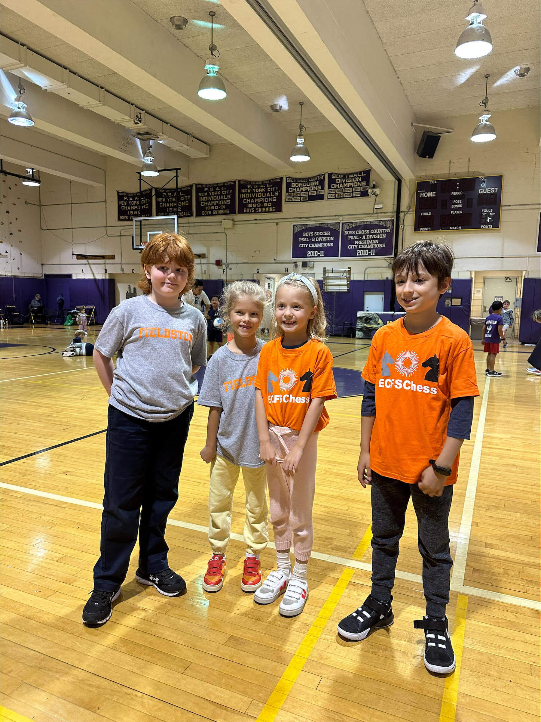 Ethical Culture Fieldston School_Feel Good Photos_ECFS chess club students posing in their team shirts