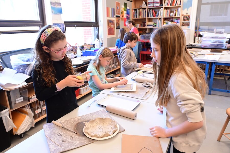 Ethical Culture Fieldston School students working with clay in art class