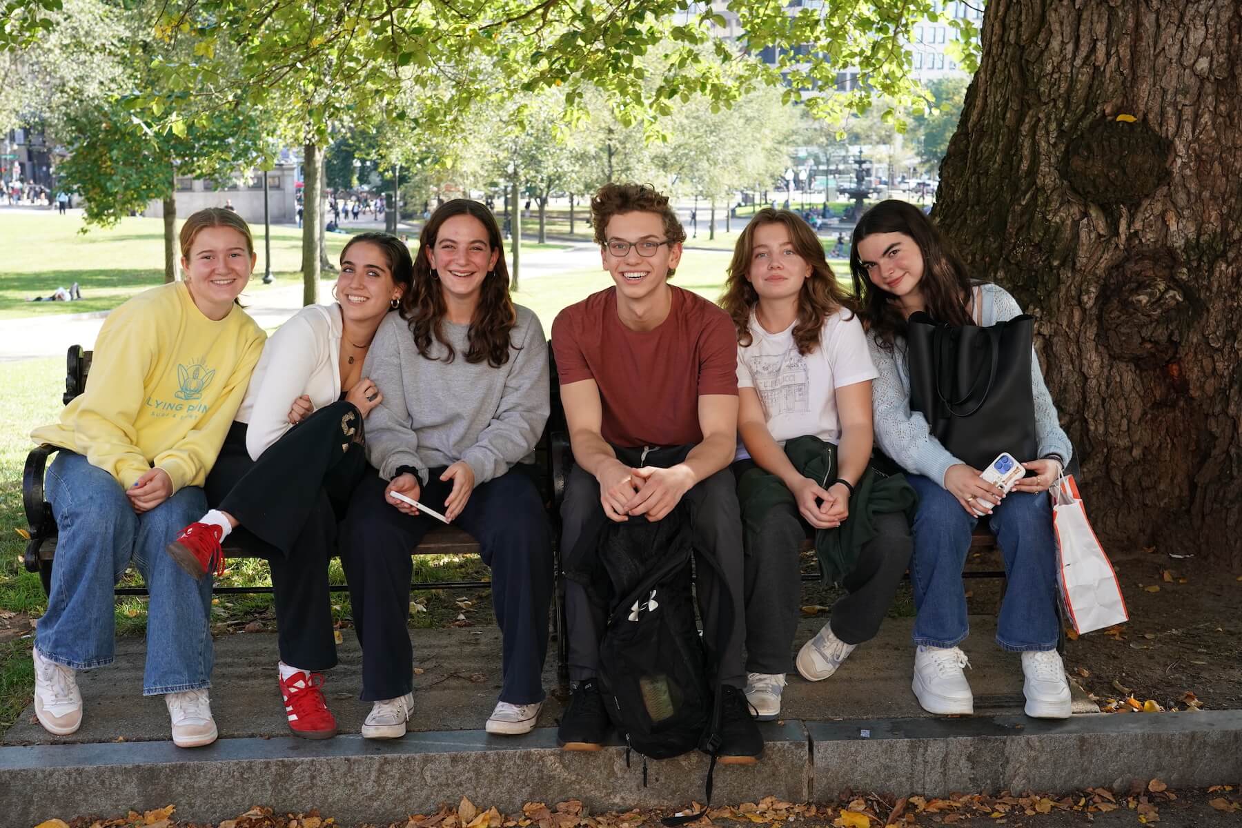 Ethical Culture Fieldston School_Feel Good Photos_Upper School students sitting in a park during a Boston field trip