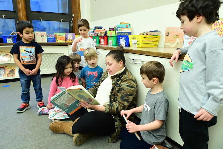 Ethical Culture Fieldston School students gathering as they listen to a read aloud