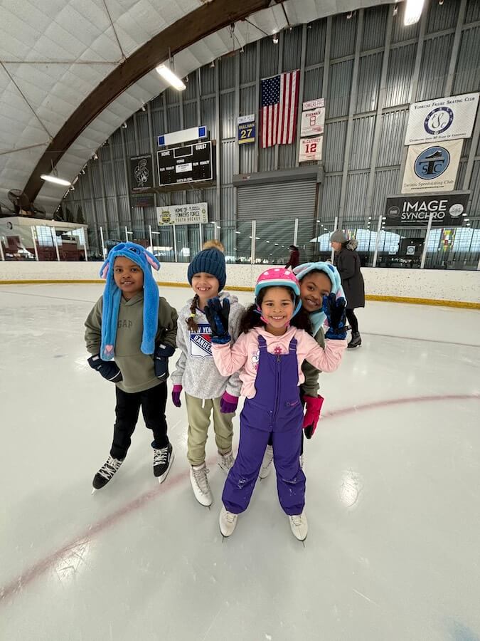 Ethical Culture Fieldston School Fieldston Lower students posing for a photo while ice skating
