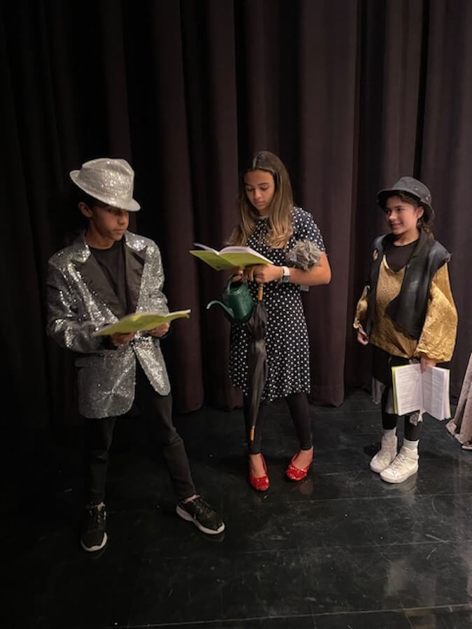 Ethical Culture Fieldston School Middle School students performing a reading in costume