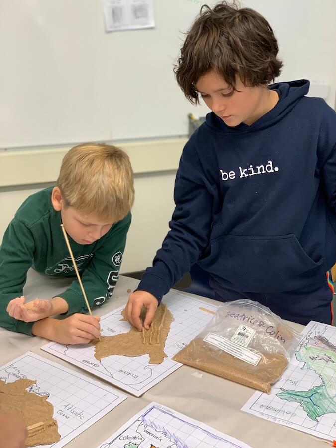 Ethical Culture Fieldston School Fieldston Lower students using salt dough to build a map relief