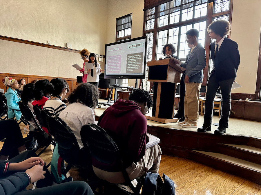 Ethical Culture Fieldston School Upper School students presenting in front of student peers