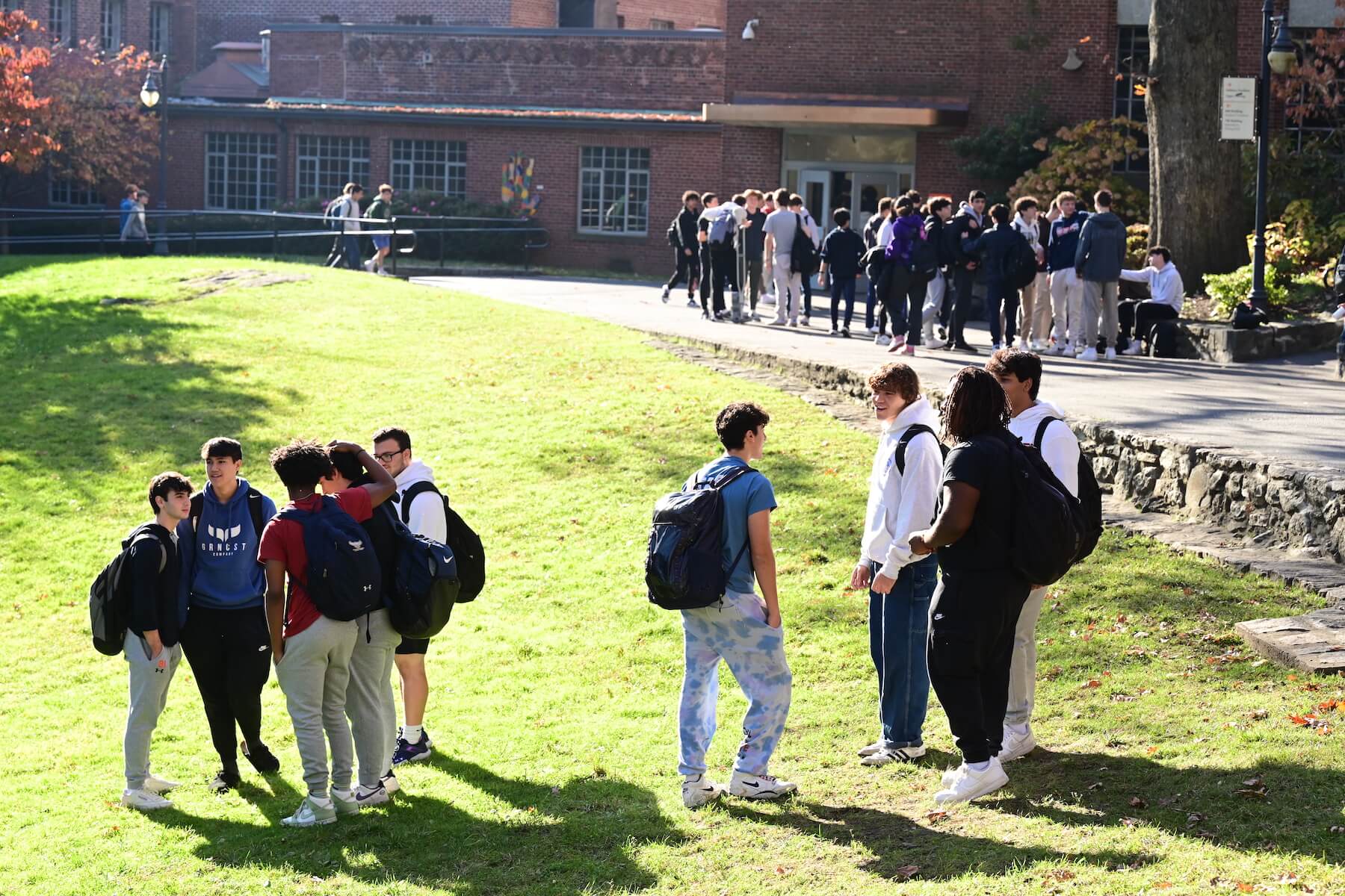 Ethical Culture Fieldston School_Feel Good Photos_Fieldston Upper students socially engaged with friends on the Quad