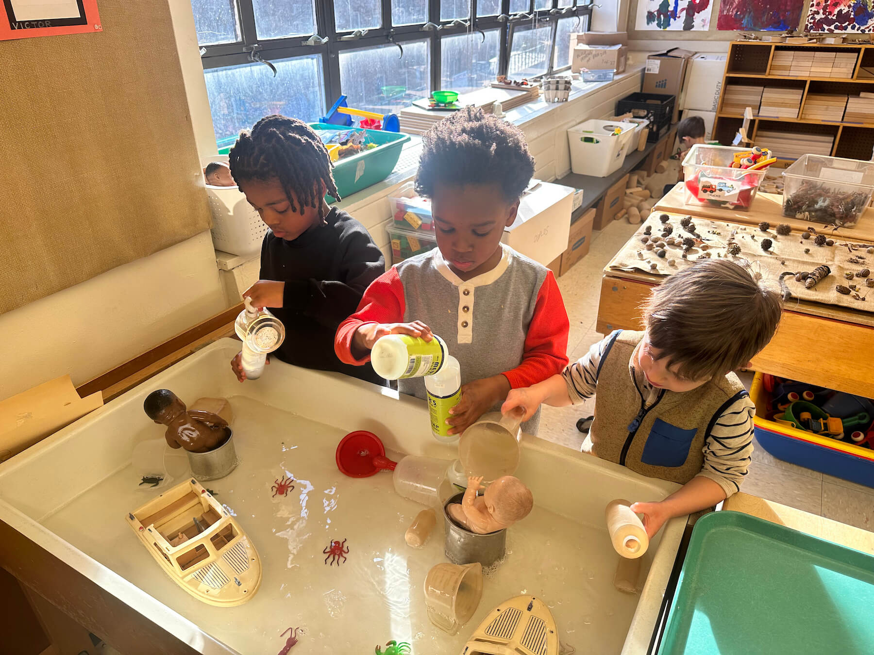 Ethical Culture Fieldston School students engaged at the water table at Fieldston Lower