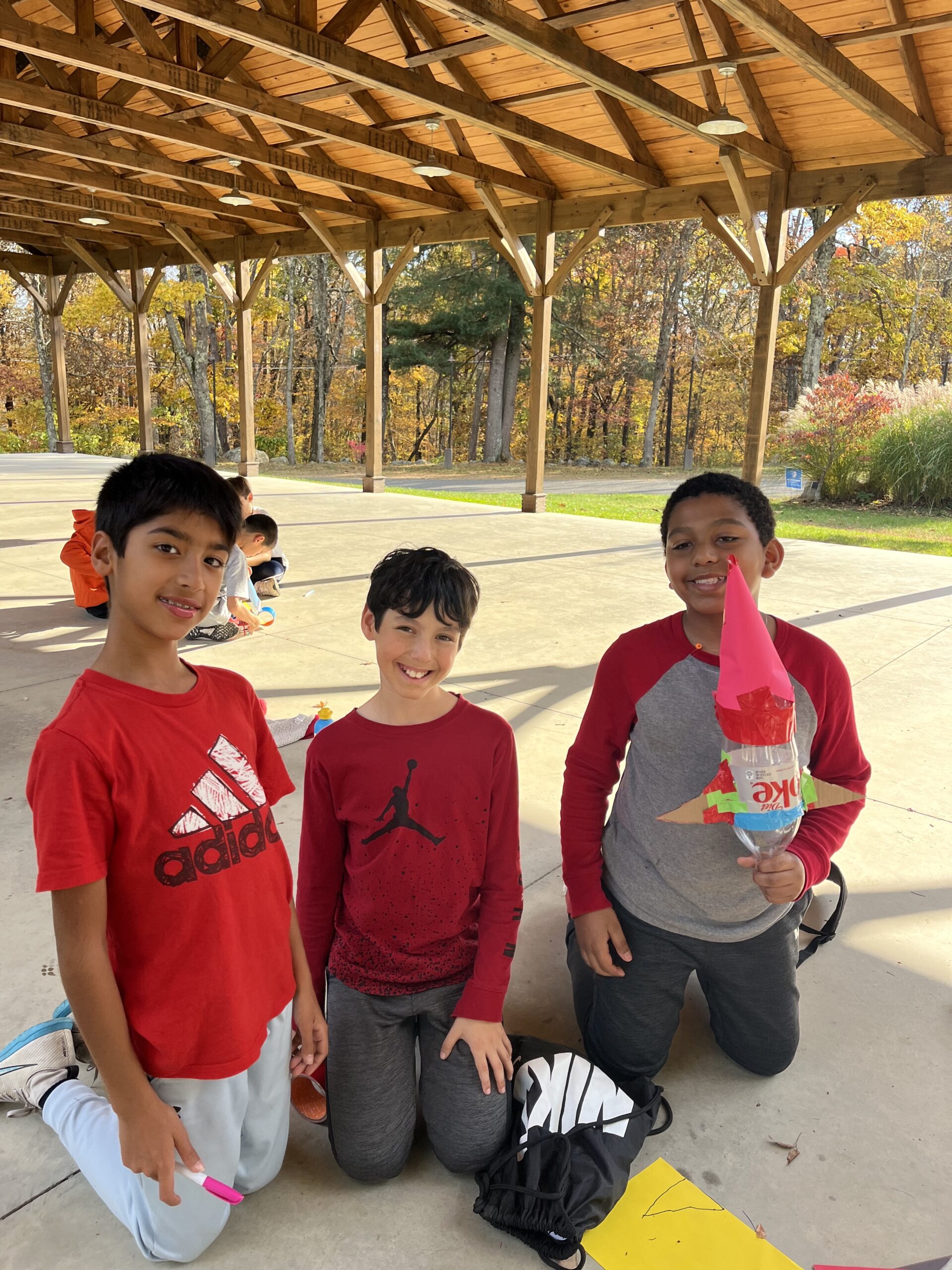 Students pose with bottle rockets at Nature's Classroom.