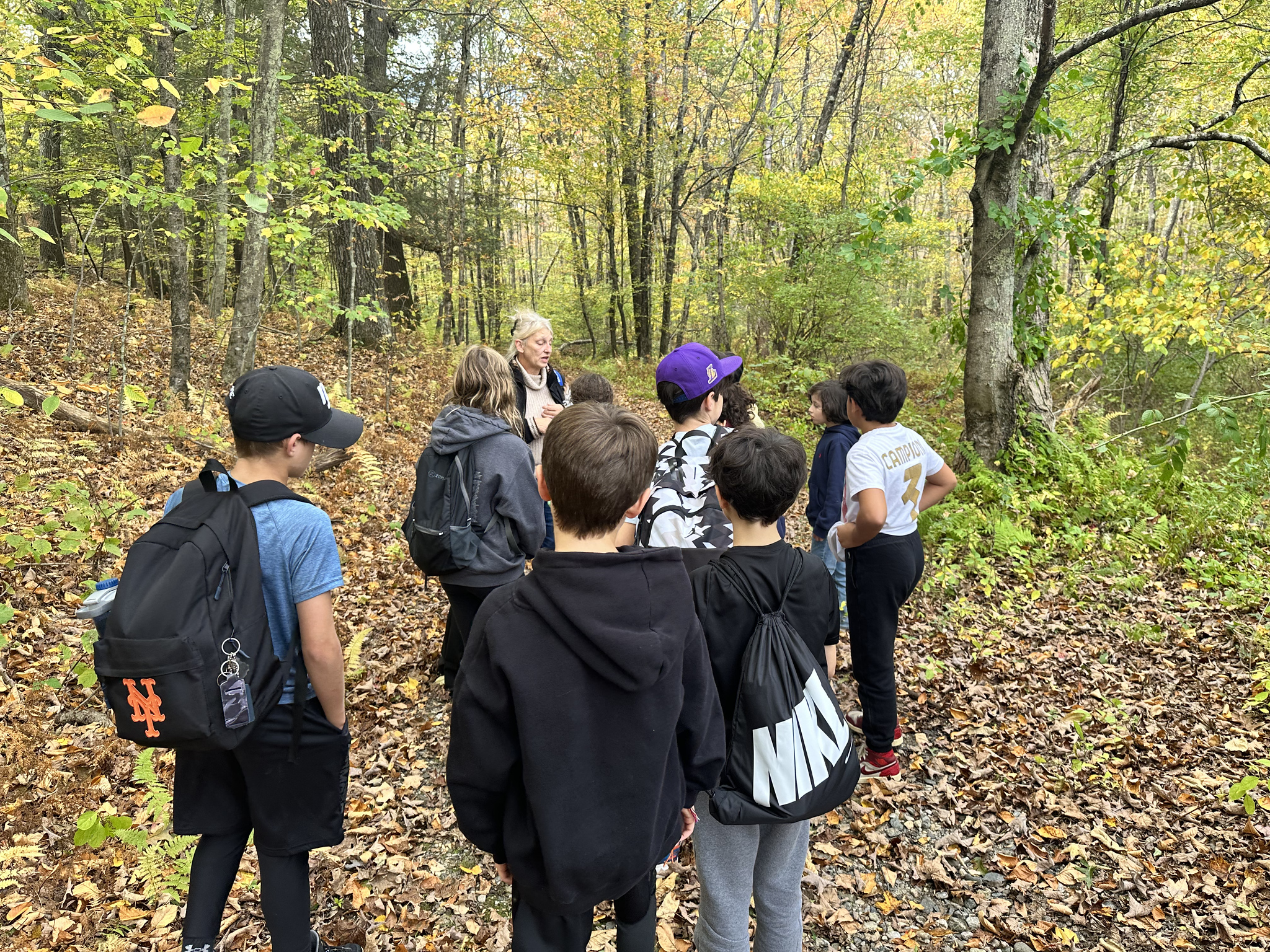 Students go on nature walk through the woods at Nature's Classroom.