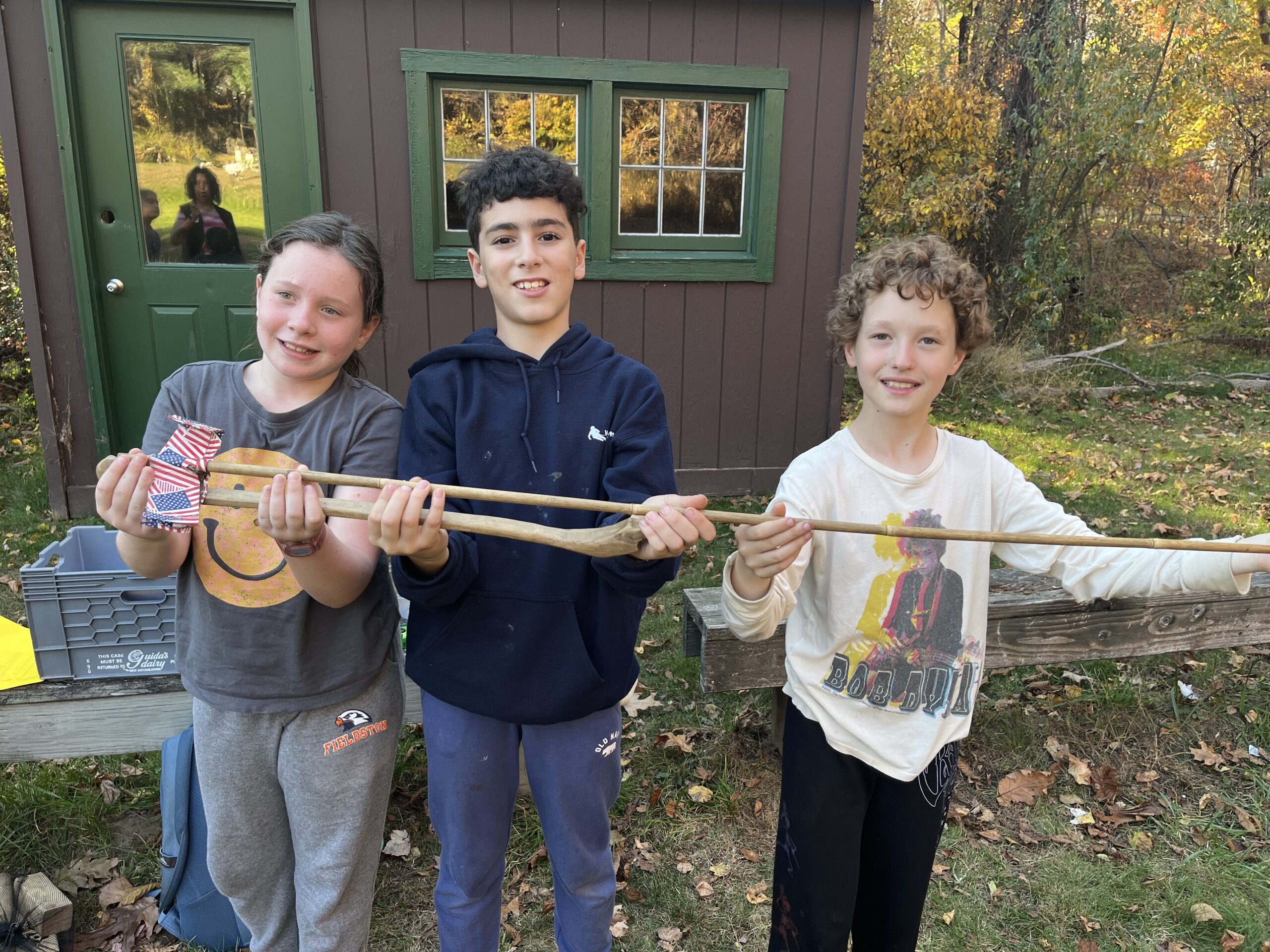 Fieldston Lower students show tool they made at Nature's Classroom.