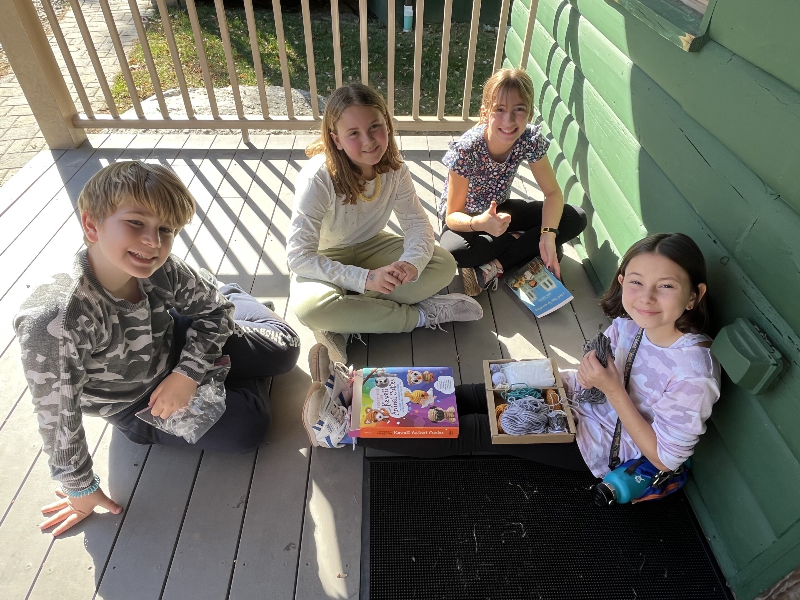 Fieldston Lower students play game together outside of cabin at Nature's Clasroom.