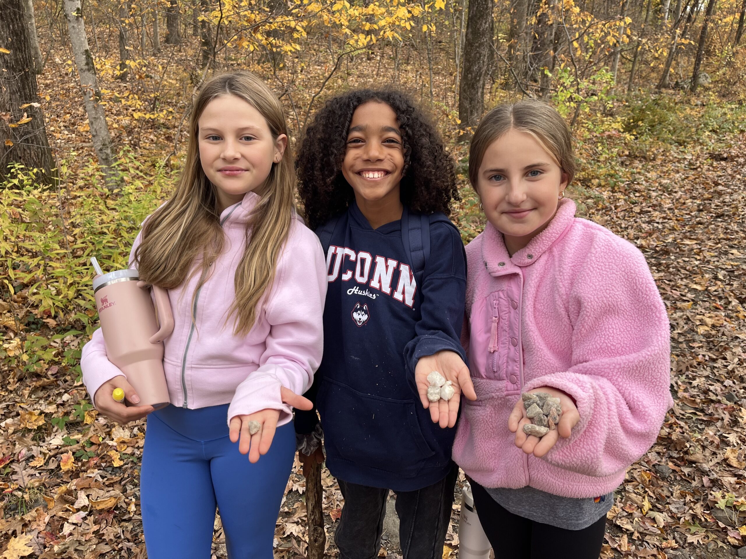 Fieldston Lower pose with rocks they found at Nature's Classroom.