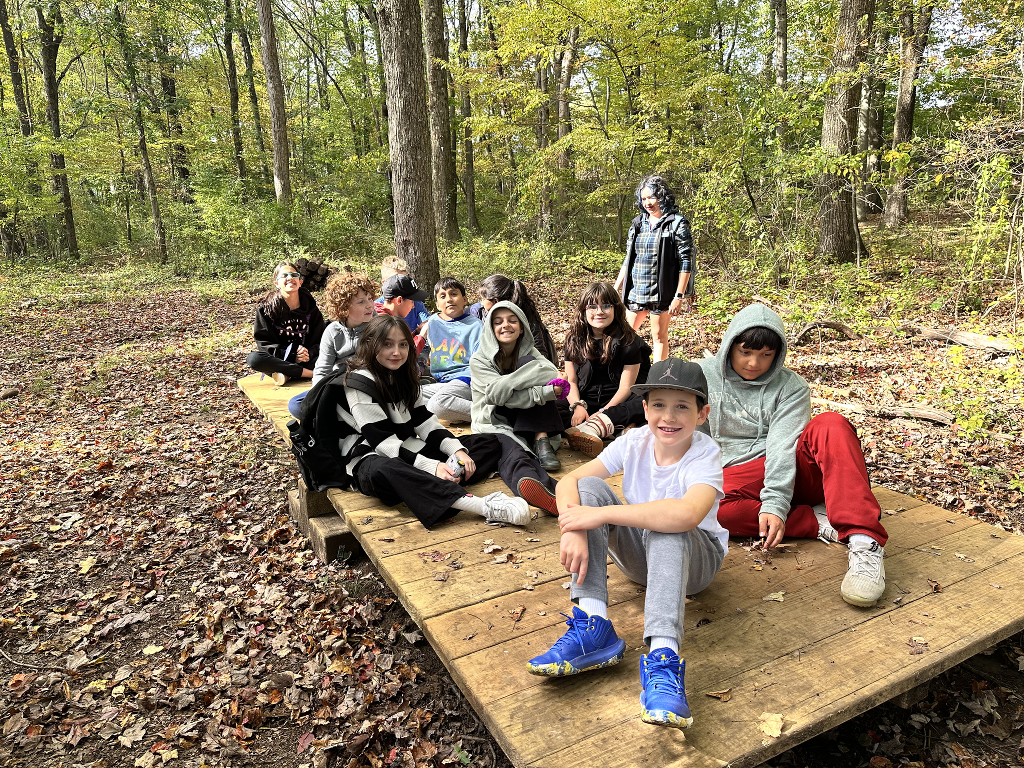 Students pose on ropes course element at Nature's Classroom.