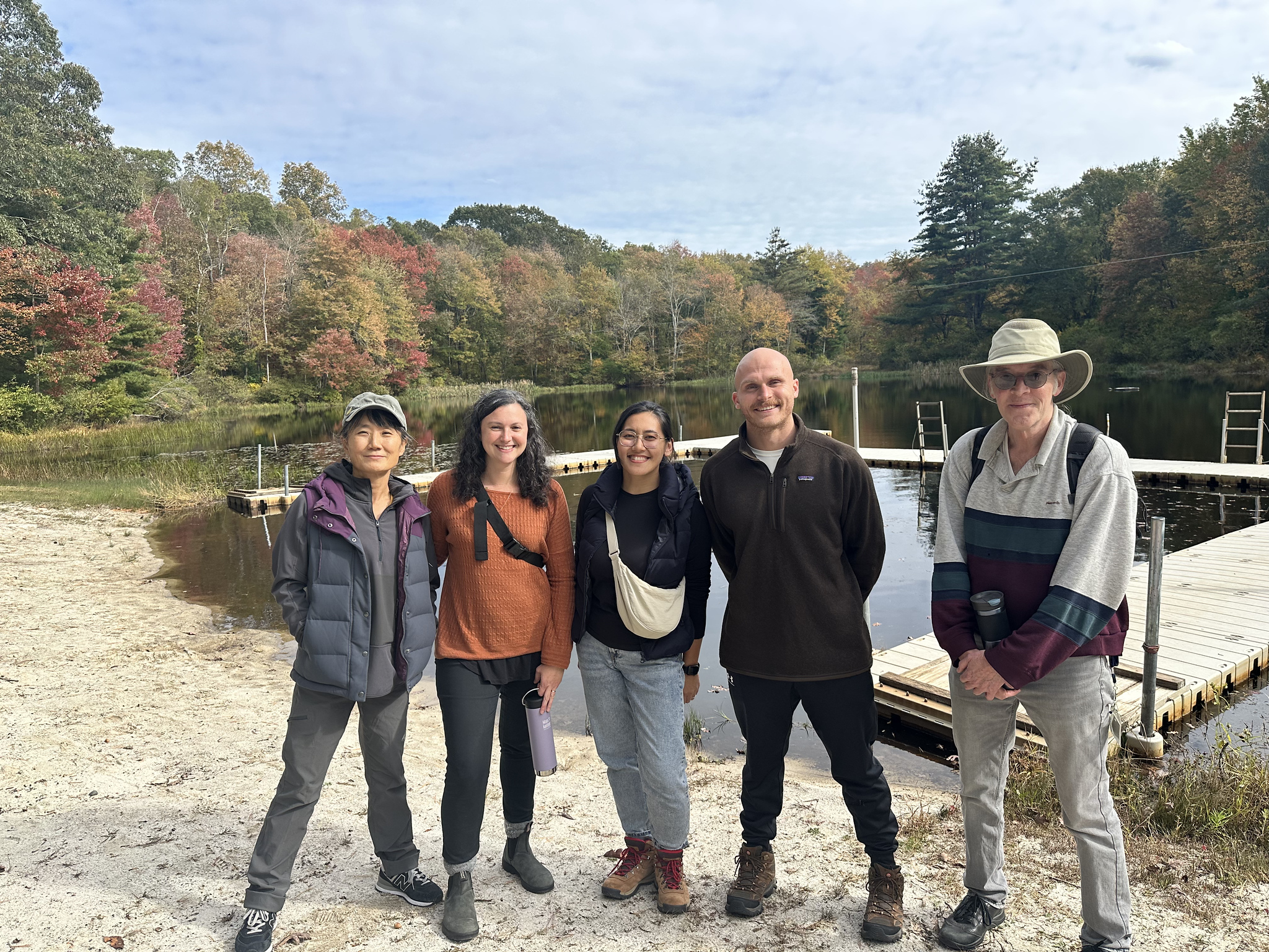 Ethical Culture chaperones pose together in front of lake.