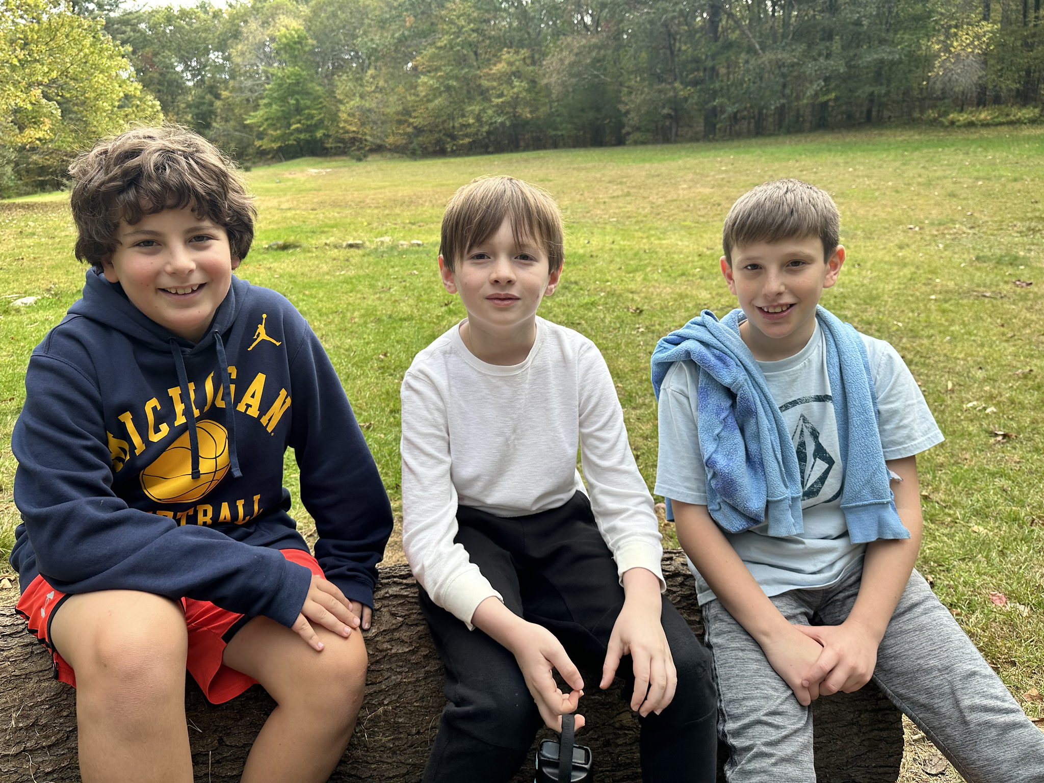 Ethical Culture students pose around firepit at Nature's Classroom.