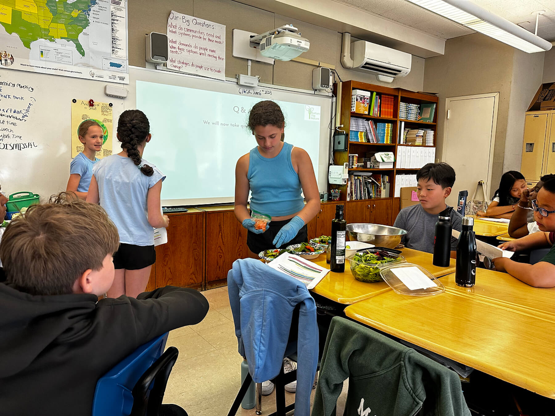 Fieldston Lower students make salad as part of their Shark Tank presentation.