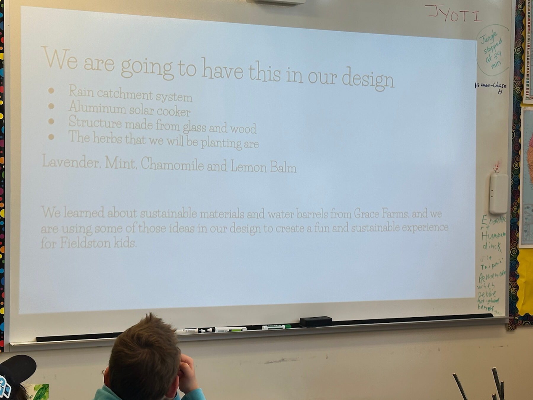 Photo of Fieldston Lower student presentation slides on white board.