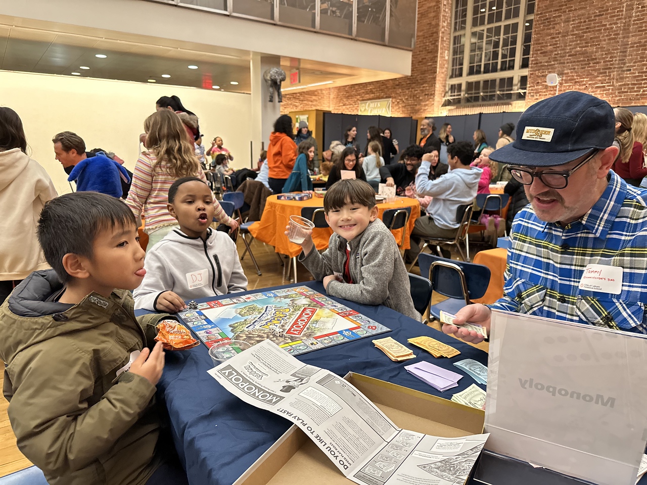 Fieldston Lower students and families enjoy games together in Fieldston Upper dining hall at Fieldston Lower Game Night.
