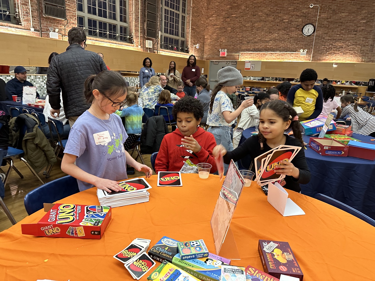 Fieldston Lower students and families enjoy games together in Fieldston Upper dining hall at Fieldston Lower Game Night.