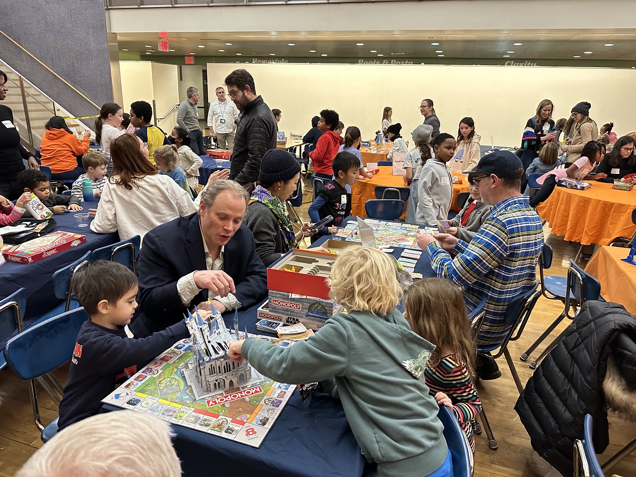 Fieldston Lower students and families enjoy games together in Fieldston Upper dining hall at Fieldston Lower Game Night.