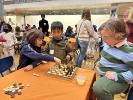 Fieldston Lower students and families enjoy games together in Fieldston Upper dining hall at Fieldston Lower Game Night.