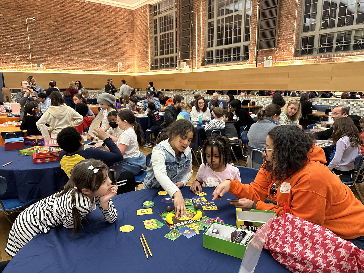 Students and families play games together at Fieldston Lower Game Night.