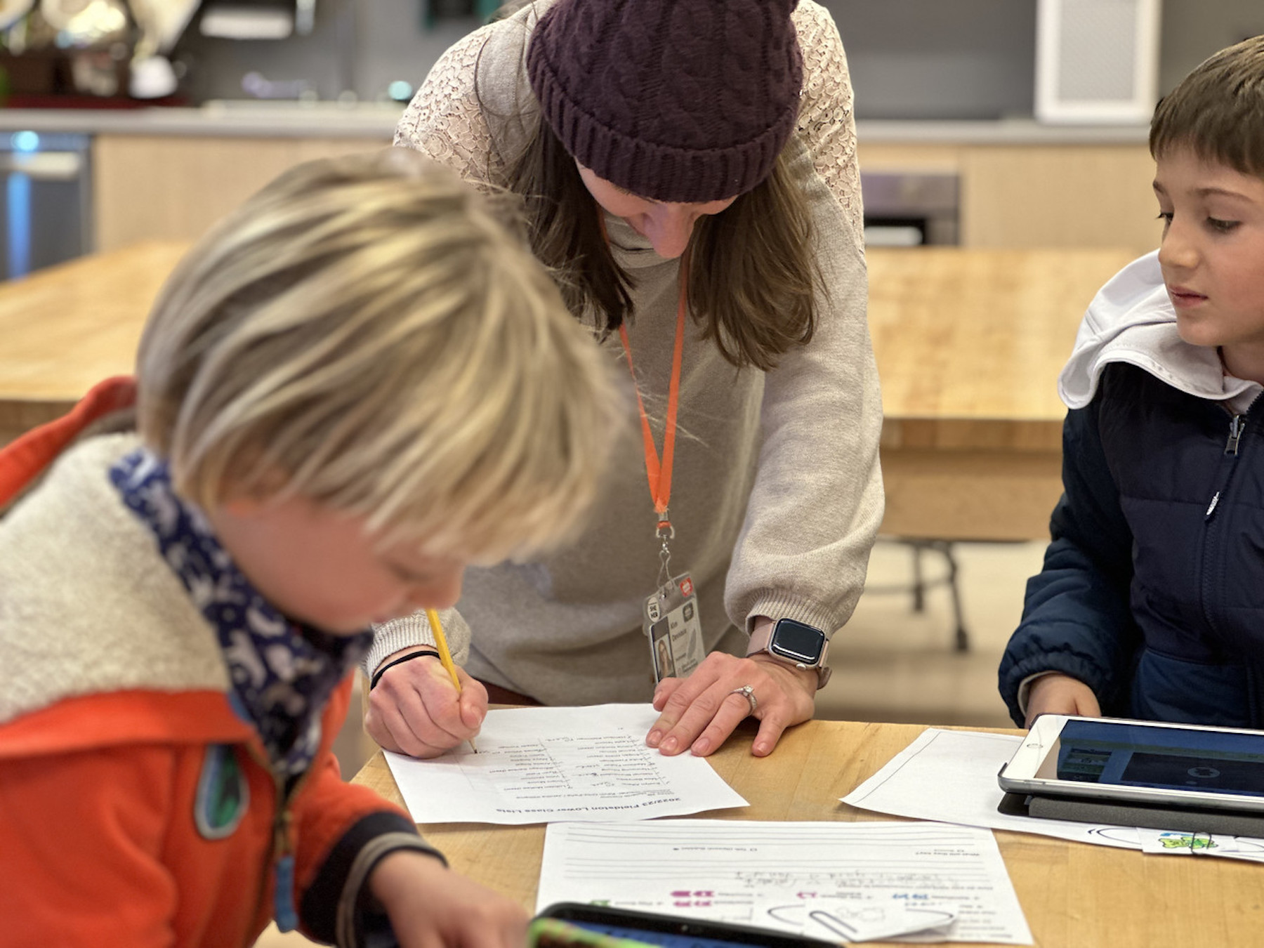 Kim Deveaux helps student with his storyboard.