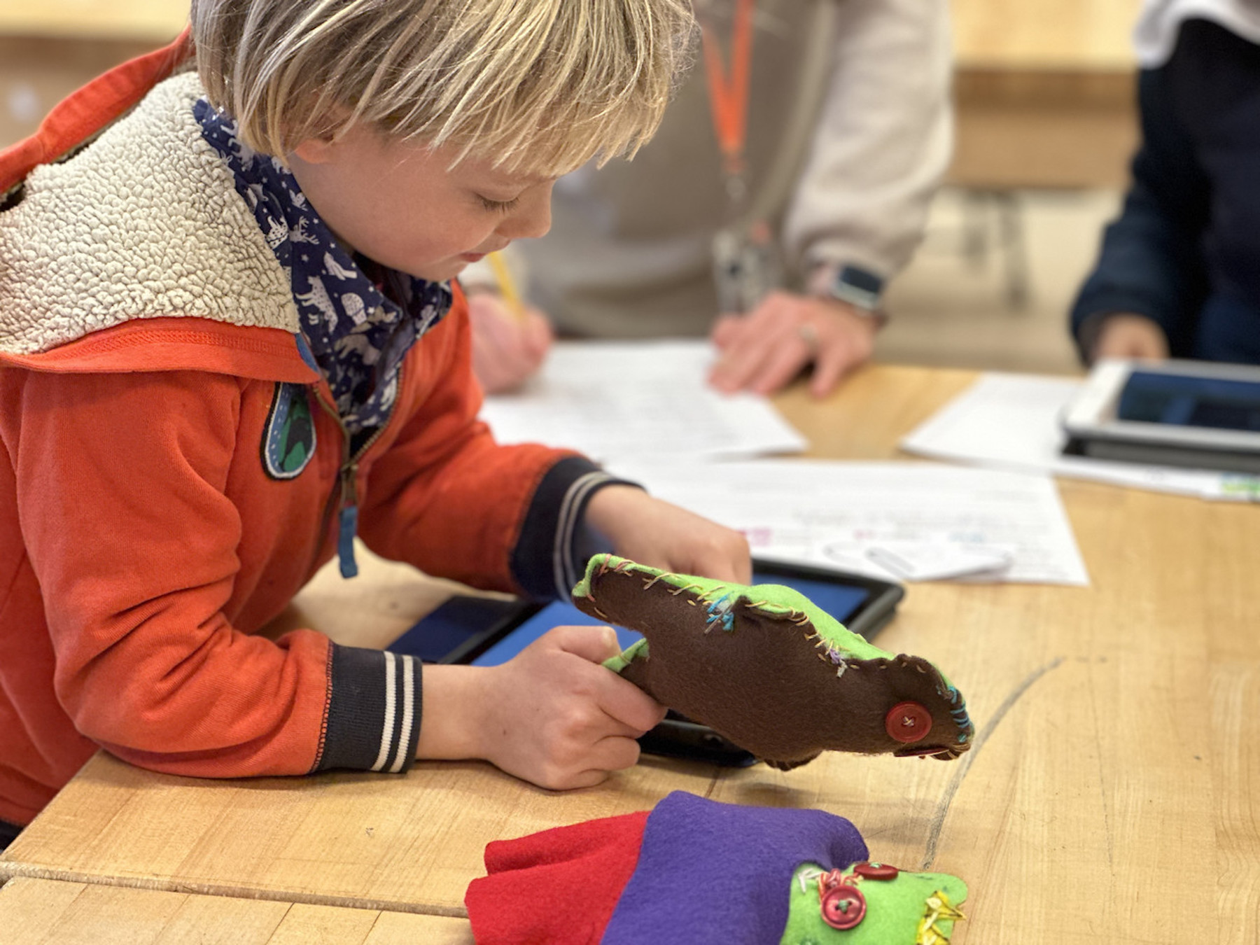 Fieldston Lower student plays with his stuffy in the classroom.