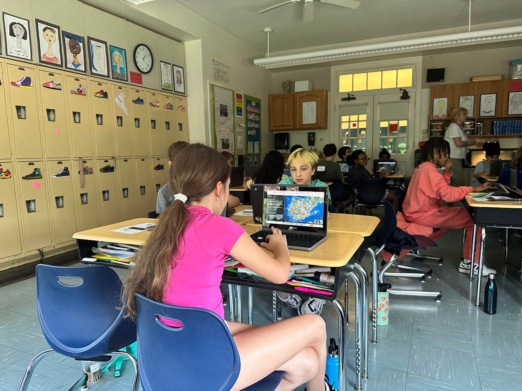 Fieldston Lower student designs her Google Earth tour on her laptop.