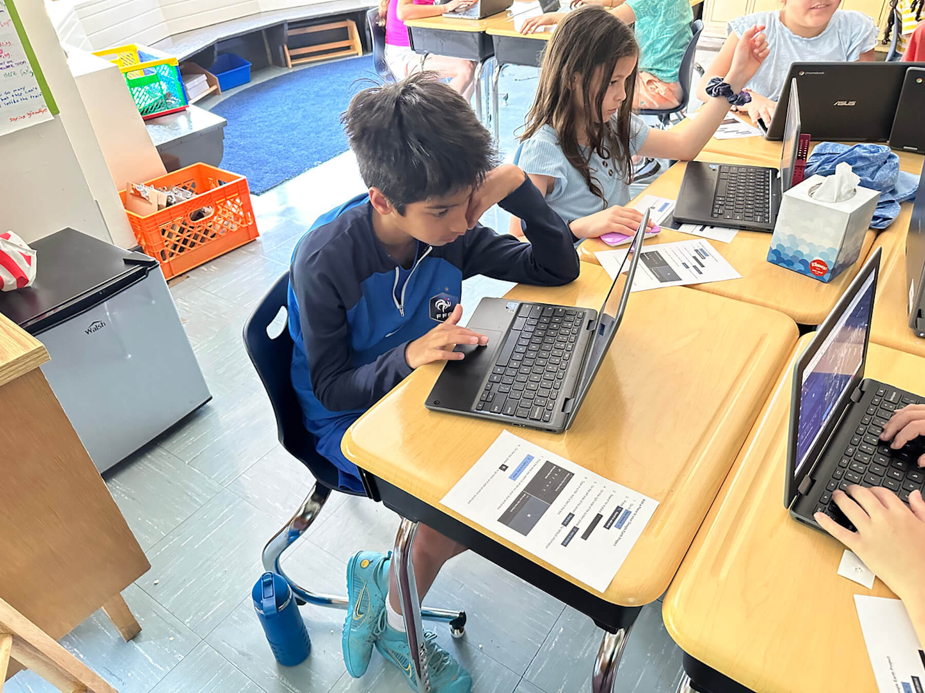 Fieldston Lower student works on Google Earth tour on laptop.