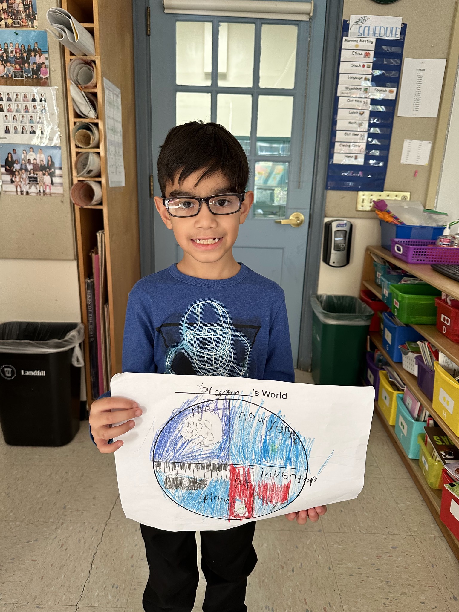 Fieldston Lower student poses with "My World" project.