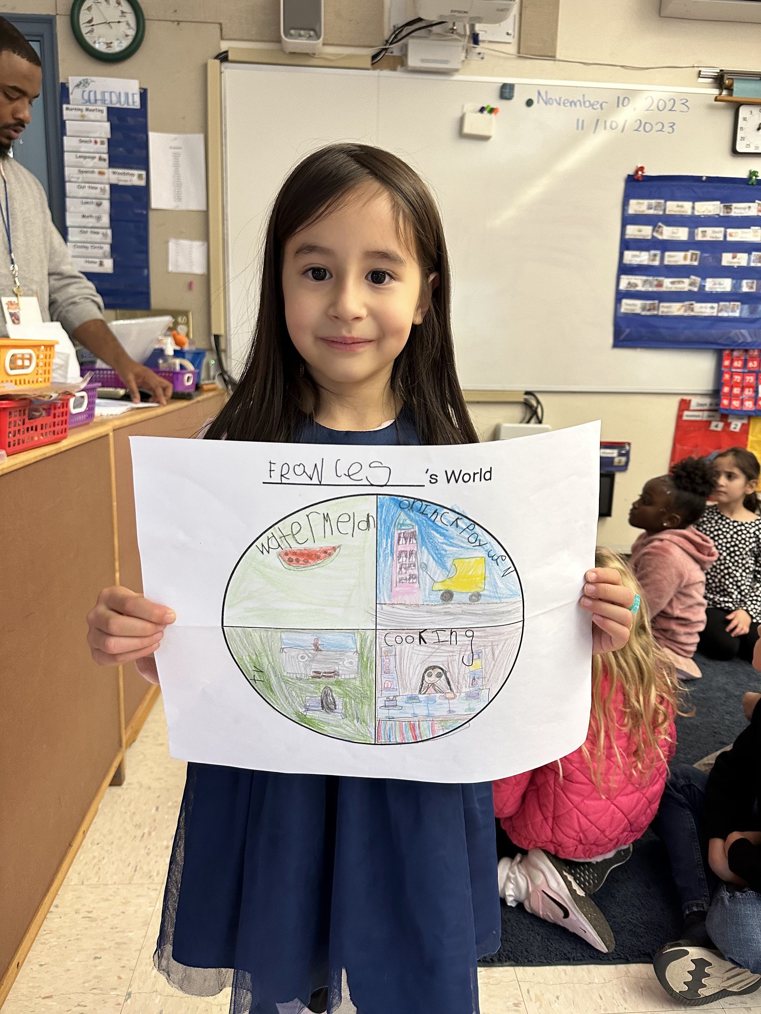 Fieldston Lower student poses with "My World" project.