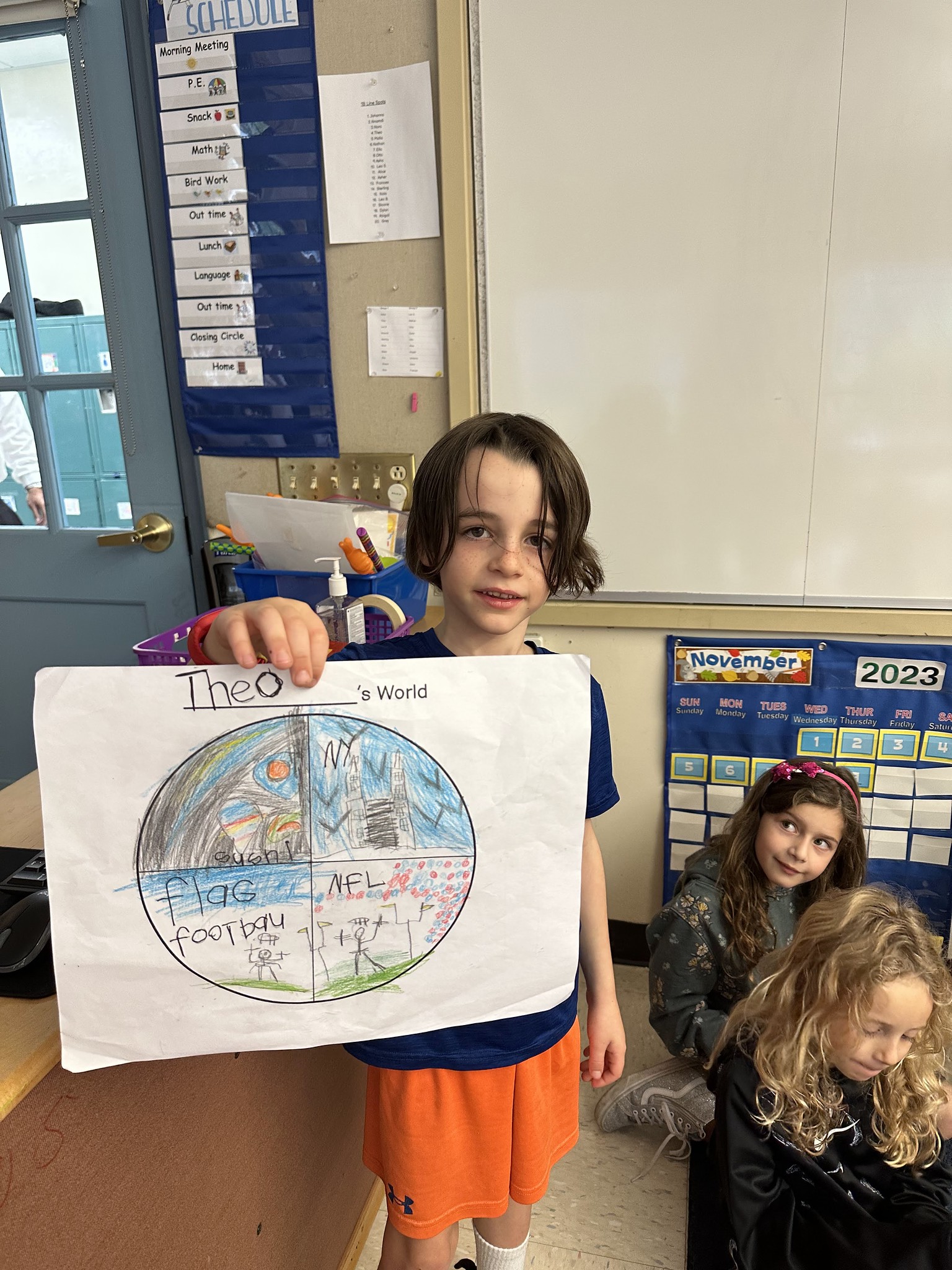 Fieldston Lower student poses with "My World" project.