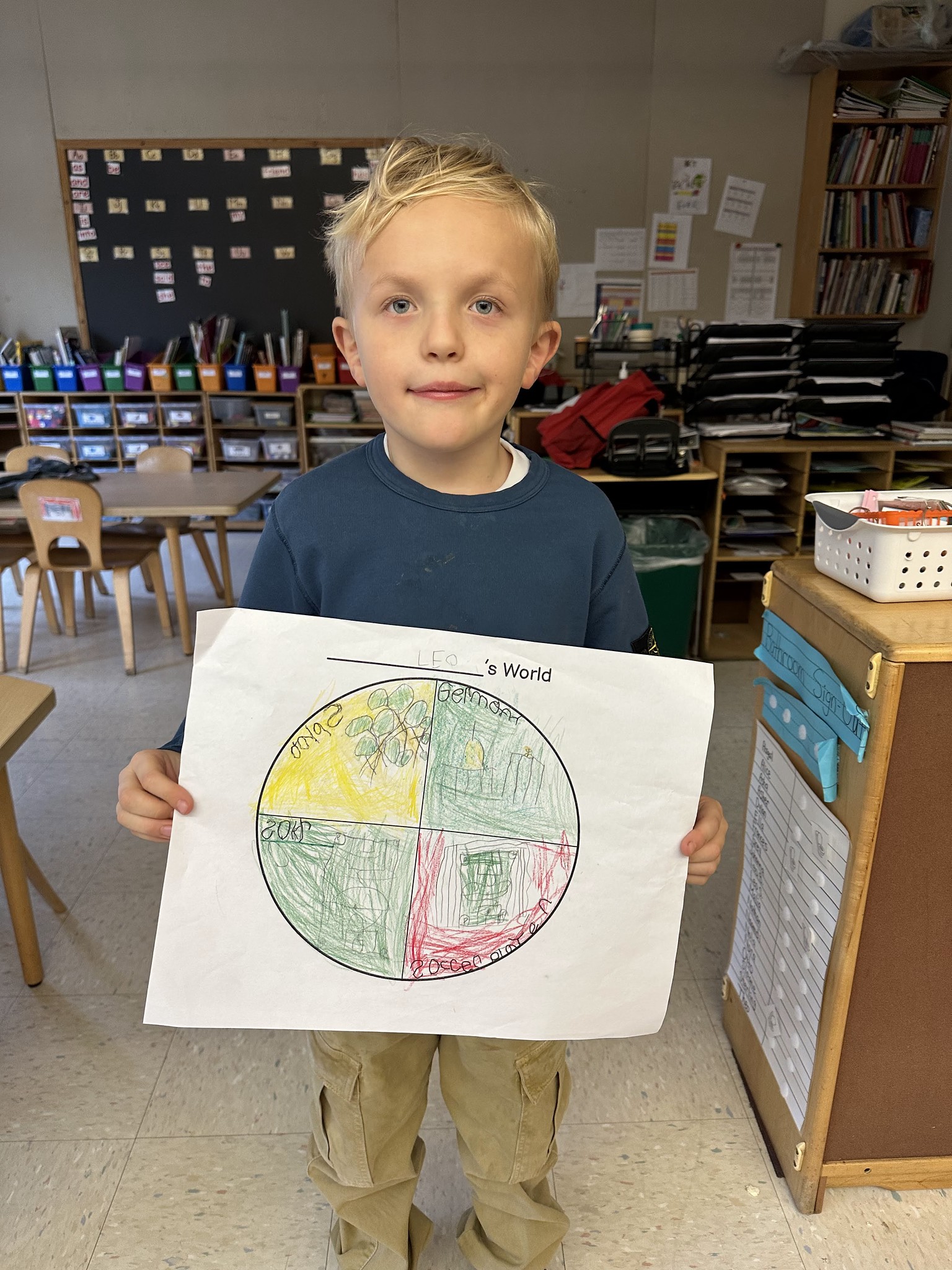 Fieldston Lower student poses with "My World" project.