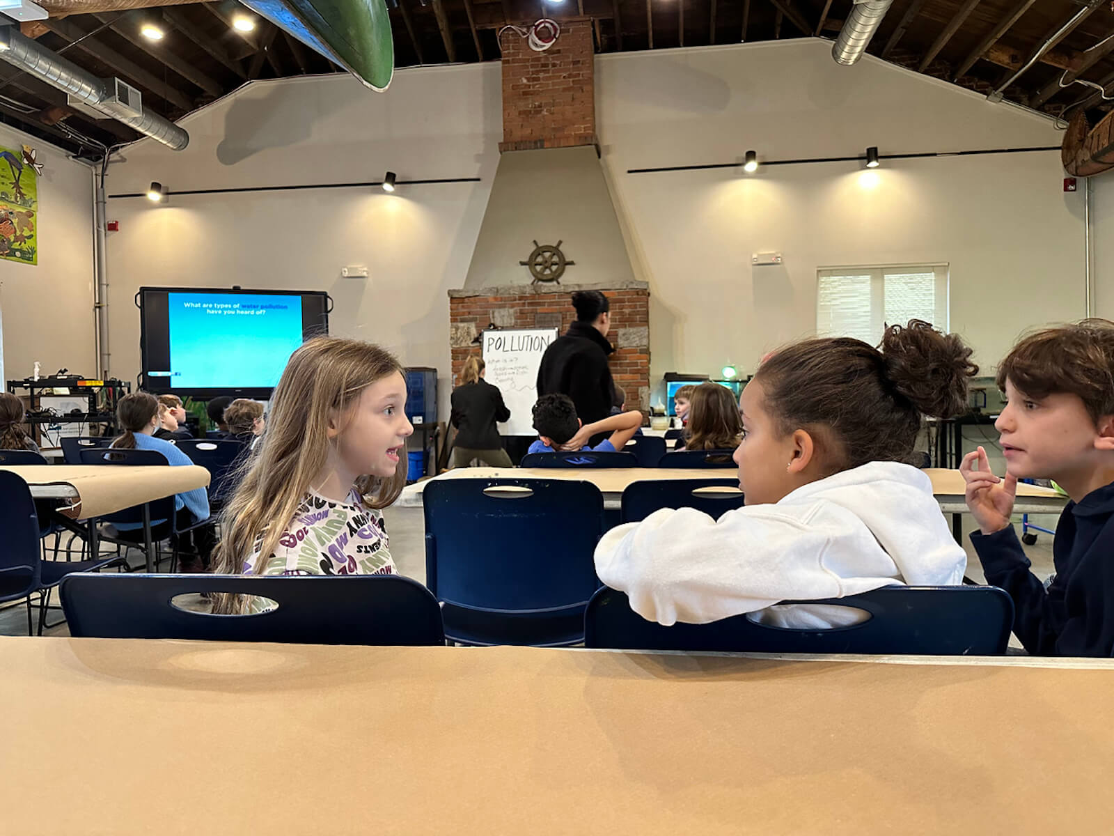 Fieldston Lower students discuss water pollution at the Beczak Center.