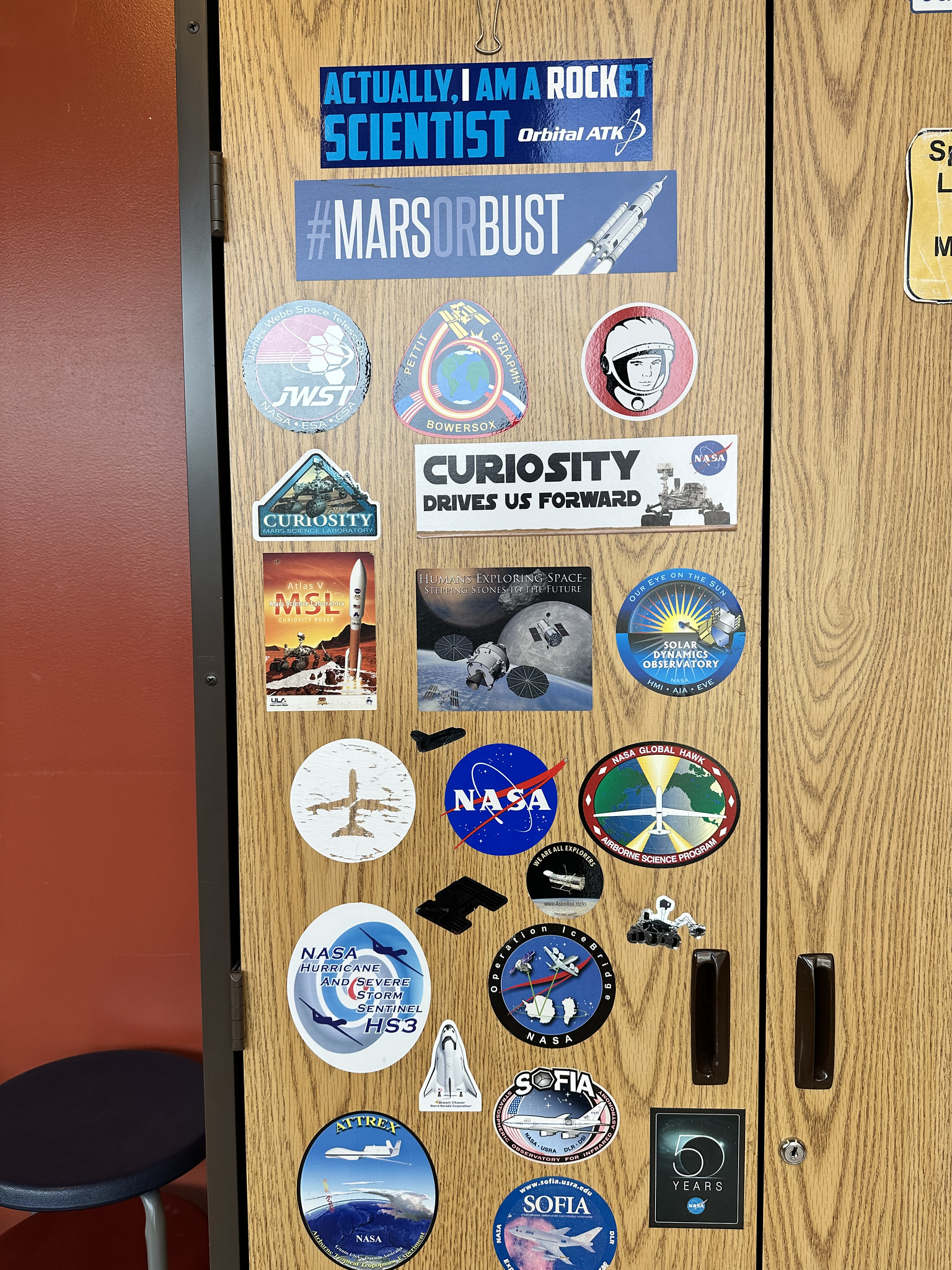 Space-themed stickers on cabinet in Michael Wilkinson's classroom.
