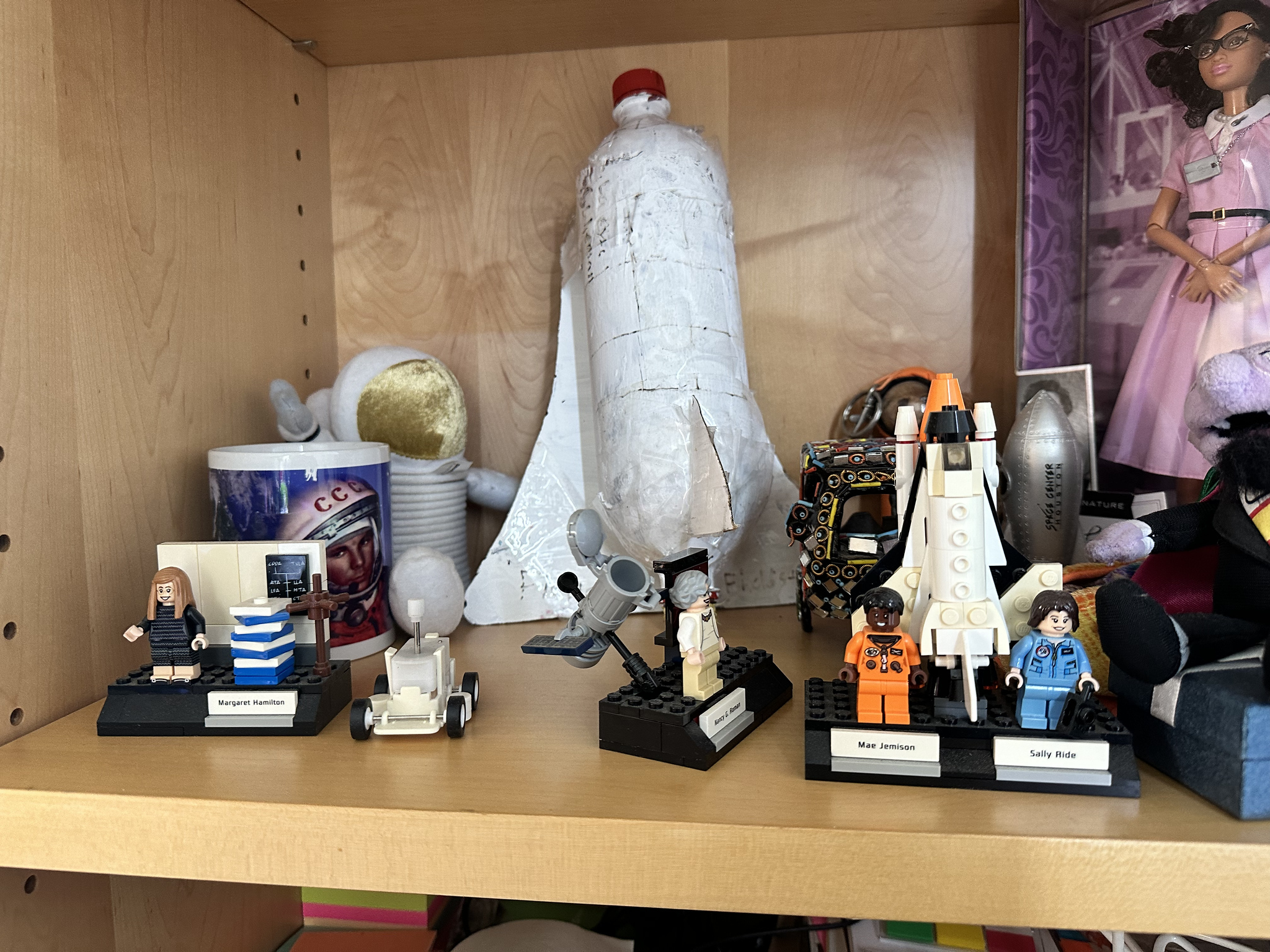 Space-themed figurines on a shelf in Michael Wilkinson's 4th Grade classroom.