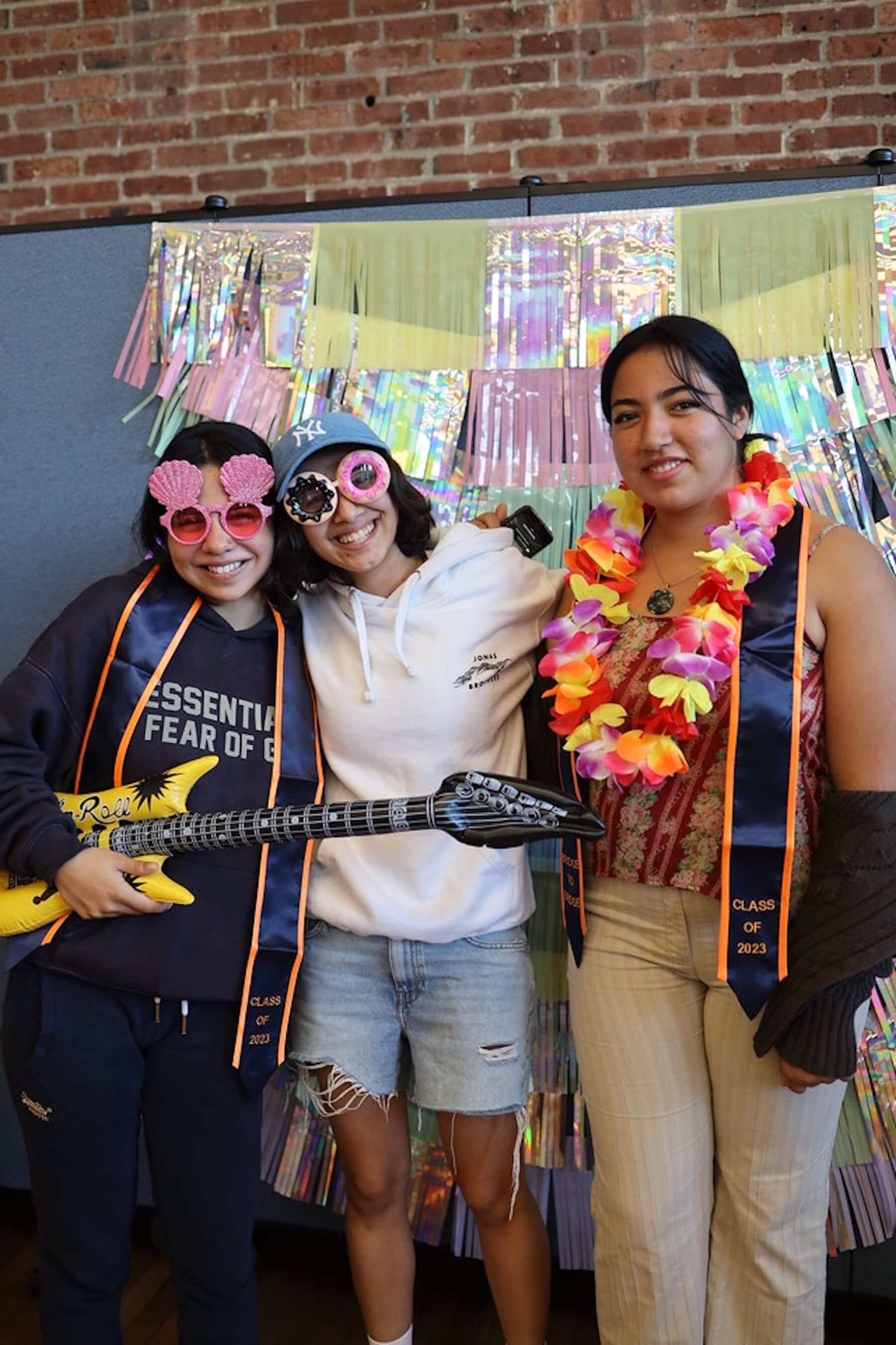 Fieldston Upper students pose in front of step-and-repeat at the Bridge to Bridge celebration dinner. 