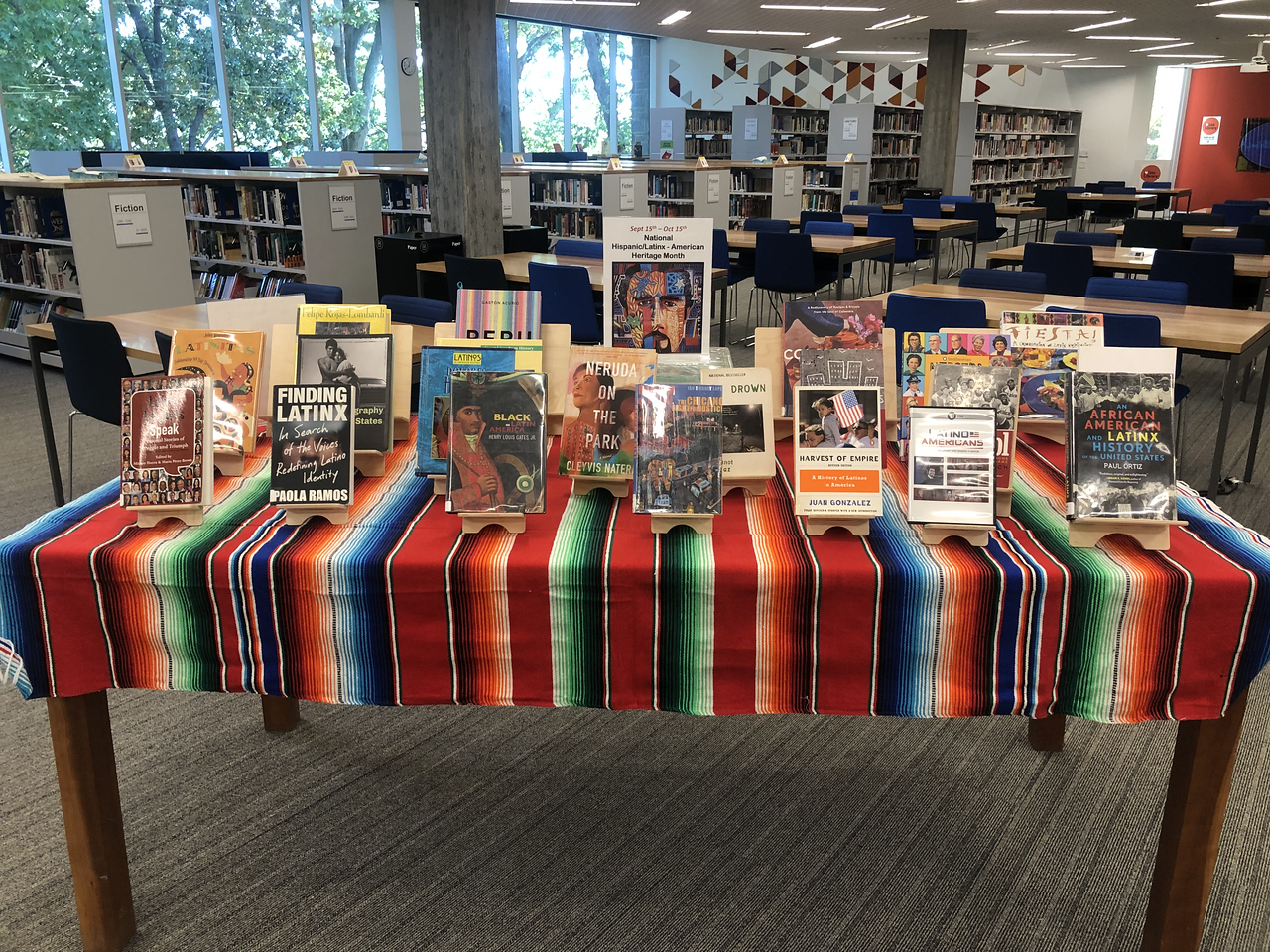 Display table in the Tate Library at ECFS displays books by Latinx authors.