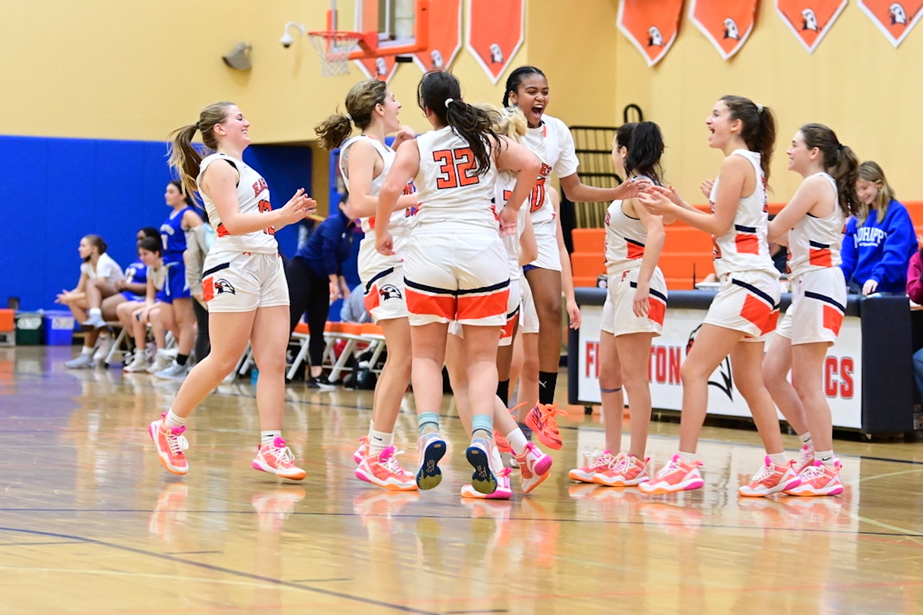 Fieldston Upper's girls varsity basketball team plays a game in the Varsity Gym. They celebrate a win!