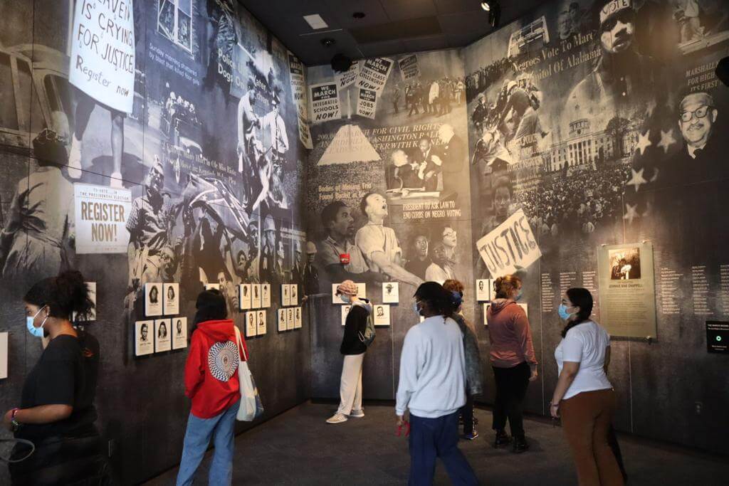 A group of Fieldston Upper students tour a museum on their Alabama trip.