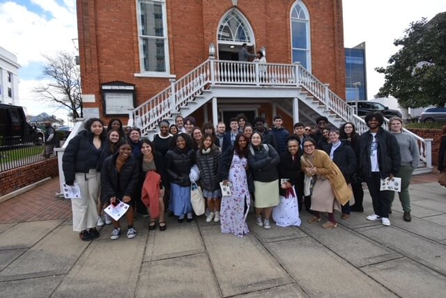 A group of Fieldston Upper students smile together in Alabama.