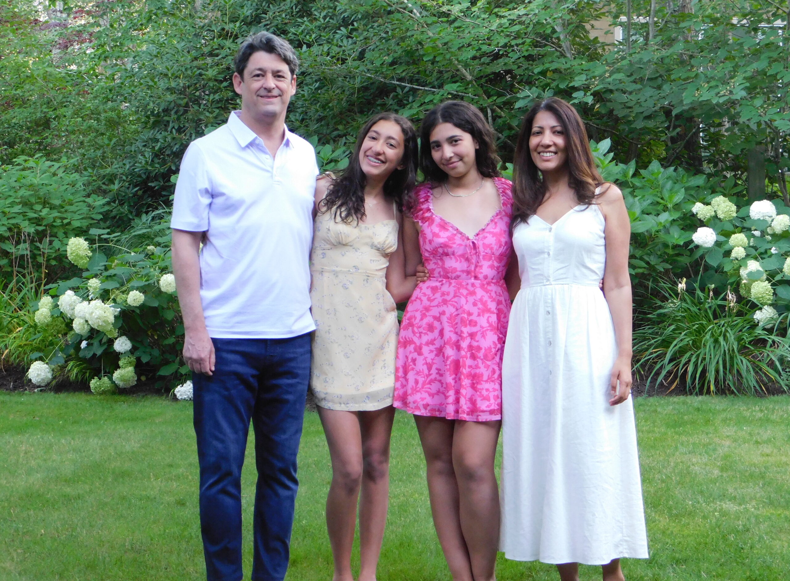 The Couchman family pose together outside.