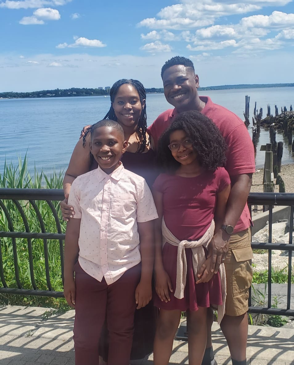 Sylvia and Jasper Clark pose with their children.