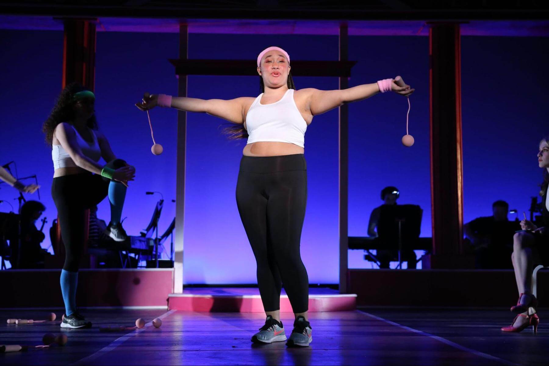 One Ethical Culture Fieldston Upper School student poses onstage in Legally Blonde.